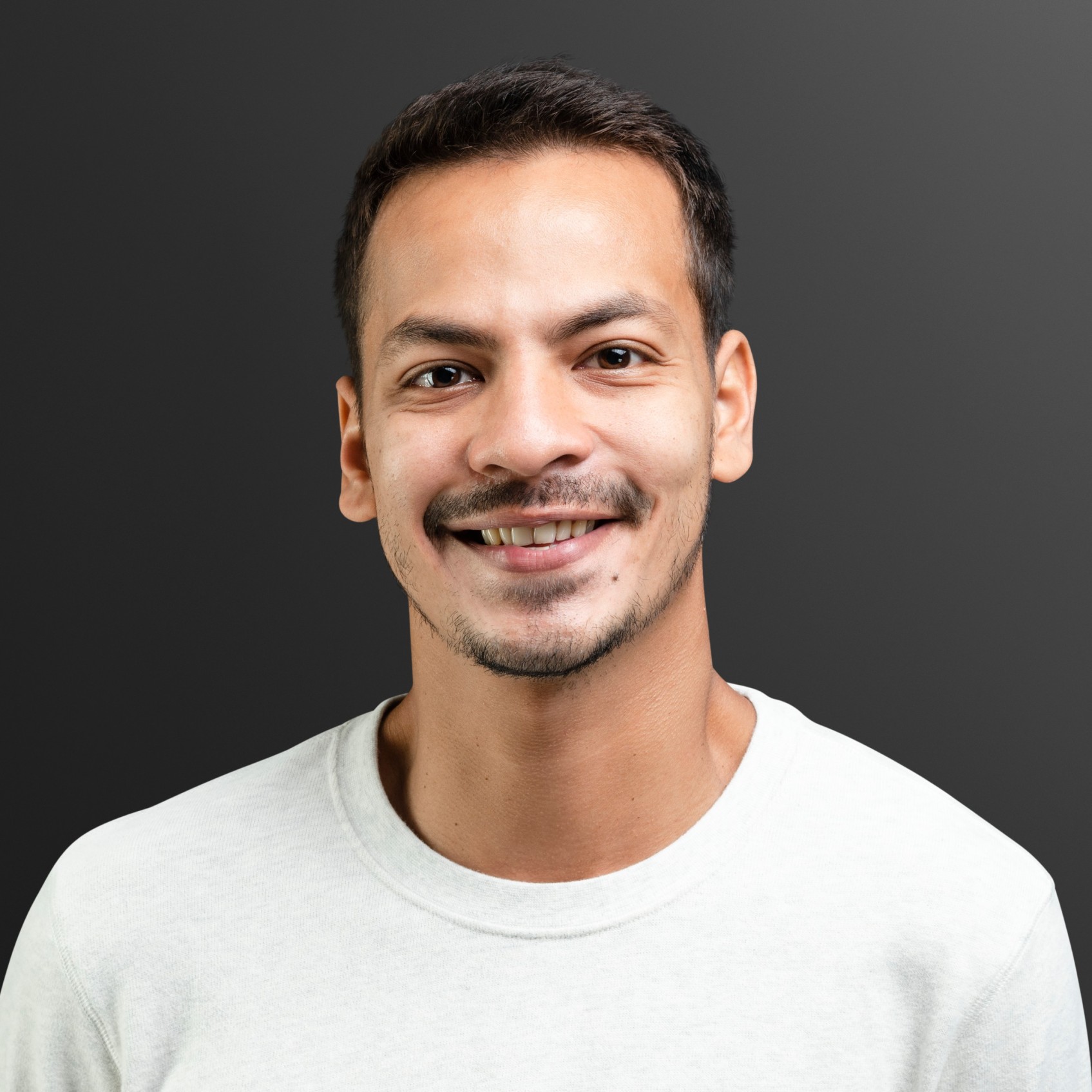 Reviews smiling man in white long sleeve tee portrait ynpwerg.jpg